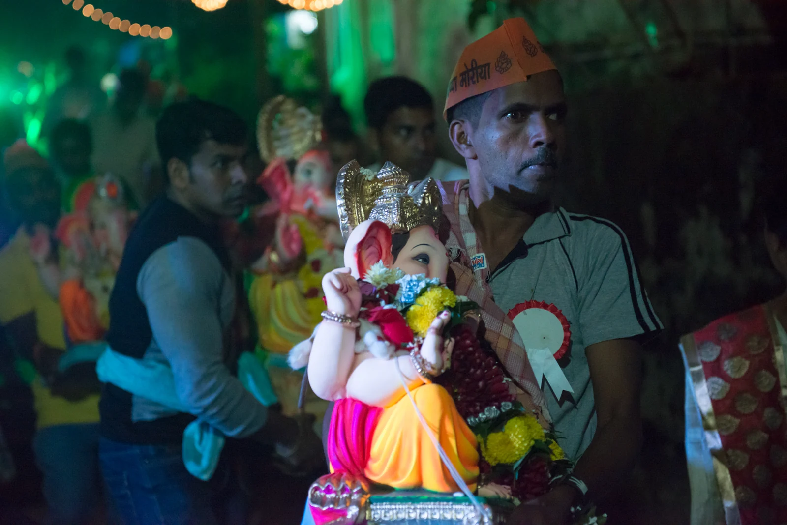 Devotees carrying decorated Ganesha murtis during a procession in Britona, Goa