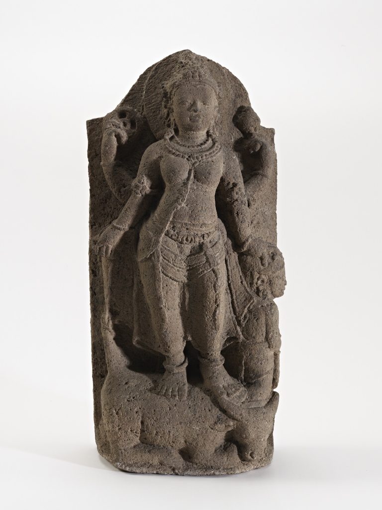 Historical sculpture of Goddess Durga as Mahishasuramardini overcoming the buffalo demon.