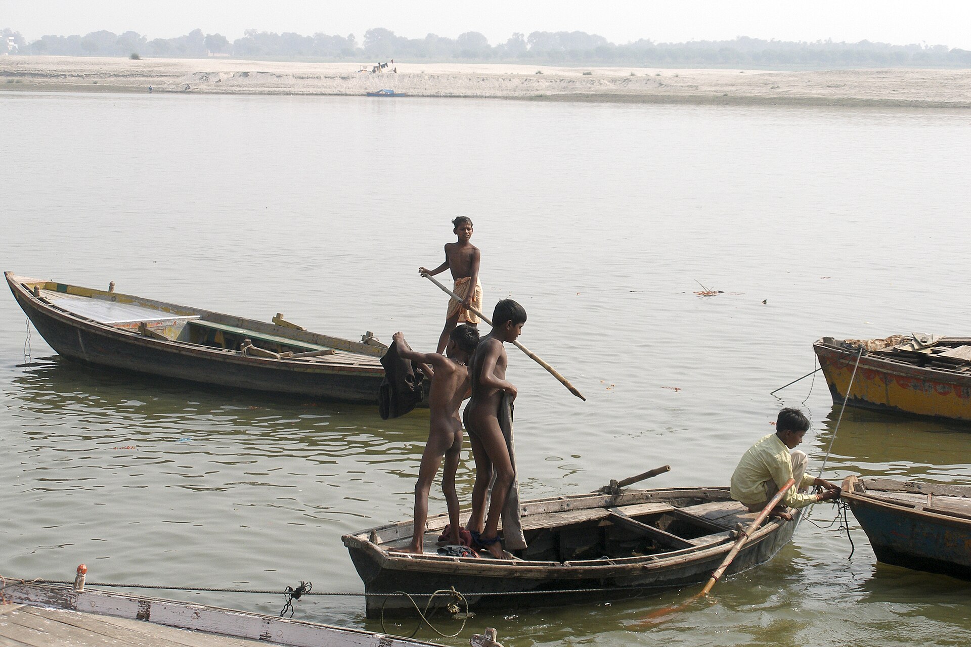 Boatmen working on the Ganges River at Varanasi, traditionally known as Kashi.