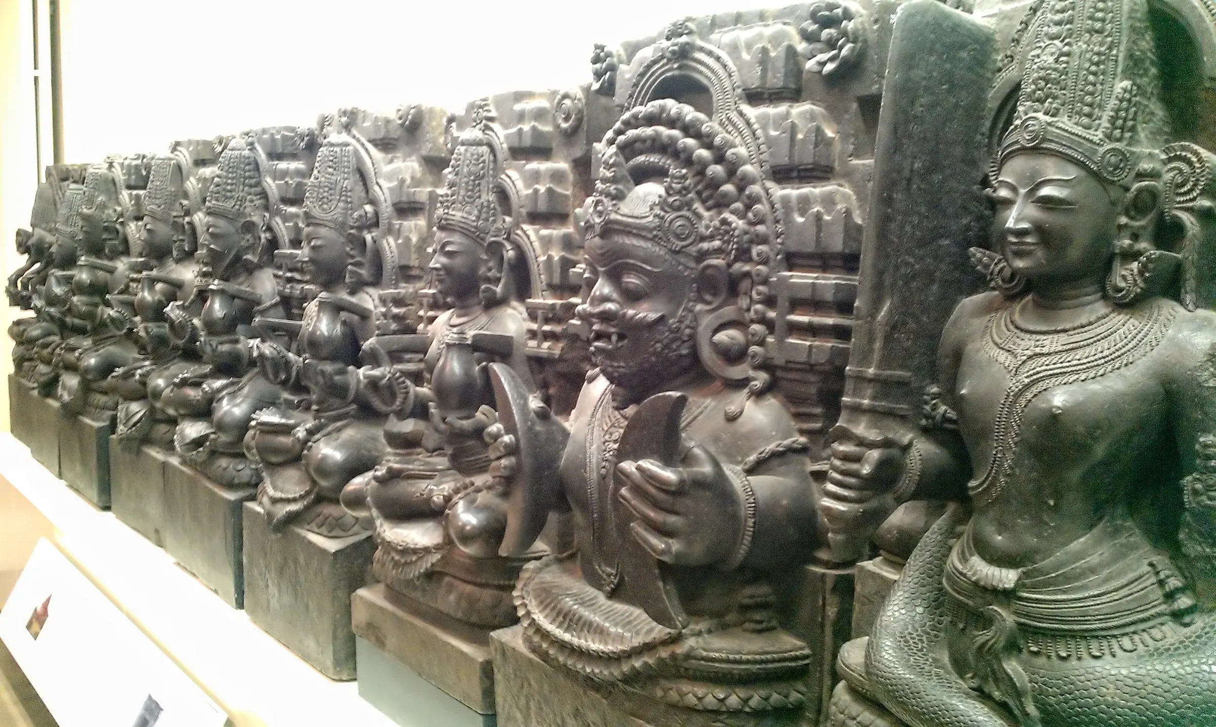 Thirteenth-century stone relief of the nine Navagrahas from Odisha, now in the British Museum.